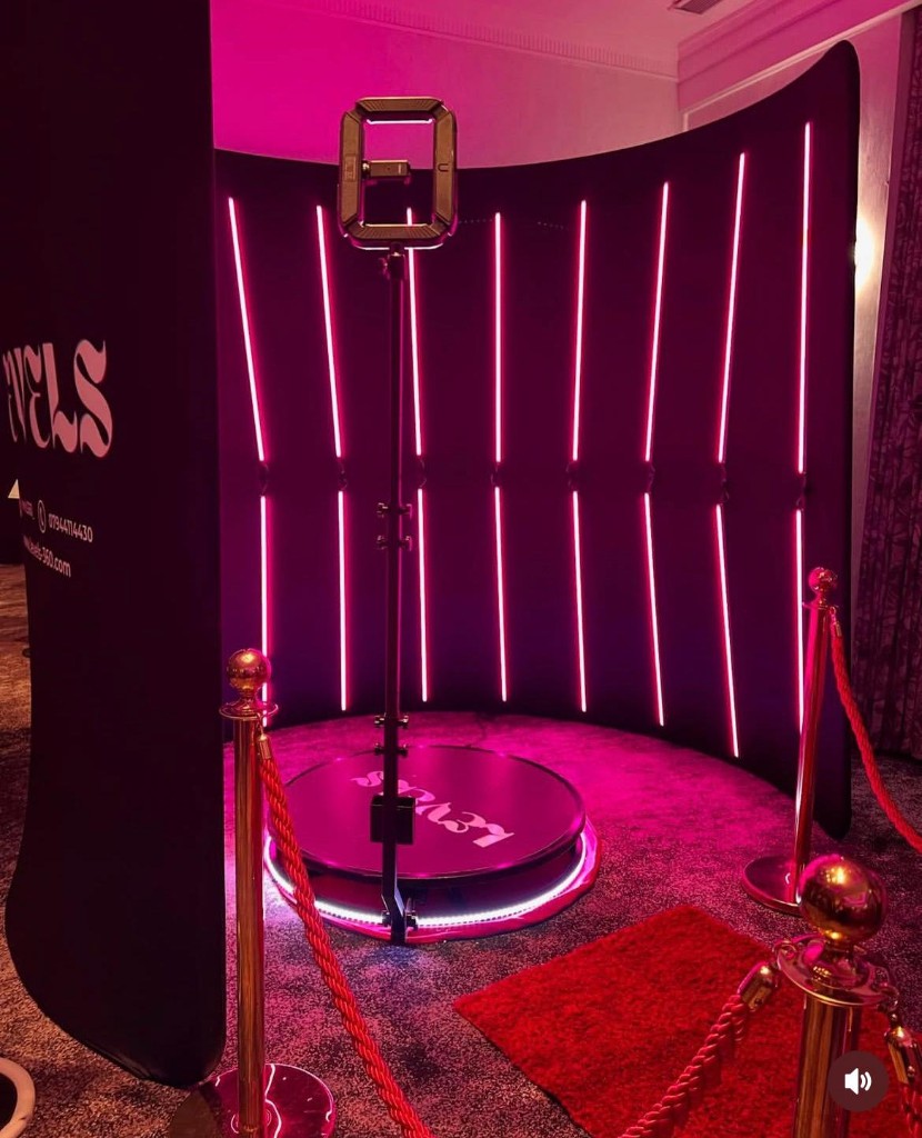Neon backdrop and VIP ropes around the 360 Video Booth